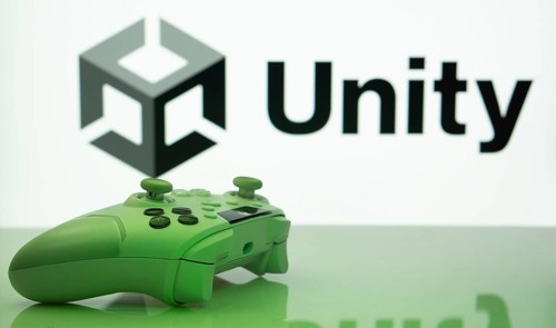 Dhaka, Bangladesh- 14 Nov 2025: A close-up of a white gamepad with the Unity seen on screen in the