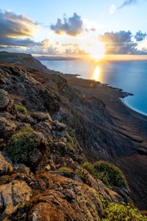View of steep cliffs on sea and coast, Mirador del Porrito viewpoint at sunset, Lanzarote, Canary