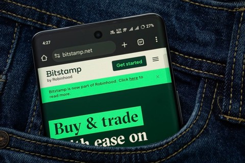 Dhaka, Bangladesh- 15 June 2025: A smartphone displaying the Bitstamp web interface peeks out of a