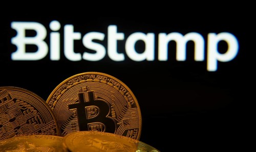 Dhaka, Bangladesh- 03 Sep 2025: Close-up of Bitcoin coins with the Bitstamp logo visible on a