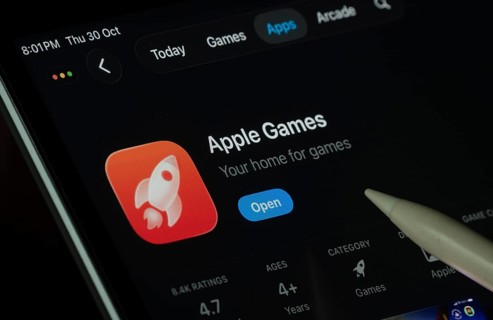 Dhaka, Bangladesh- 30 Oct 2025: Apple Games app displayed on a iPad screen in dark mode with a