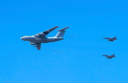 Indian Air Force aerobatic team performs during rehearsals ahead of the air show organised as part
