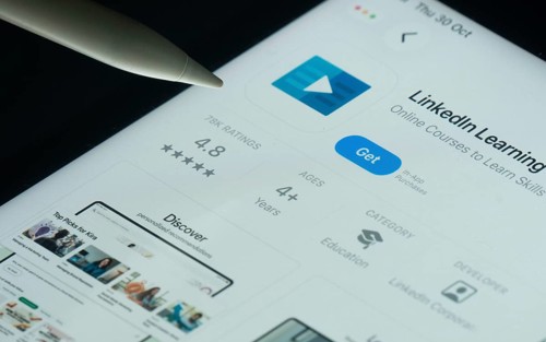 Dhaka, Bangladesh- 30 Oct 2025: Linkedin Learning app on a iPad screen with a pen pointing at the