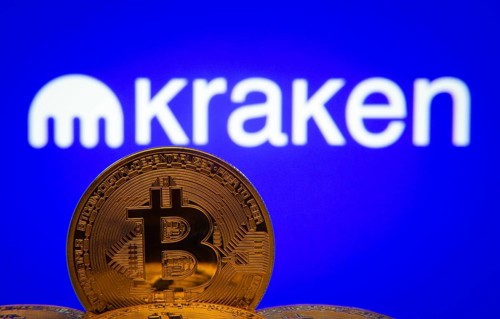 Dhaka, Bangladesh- 01 Nov 2025: Close-up of Bitcoin coins with the Kraken logo visible on a screen