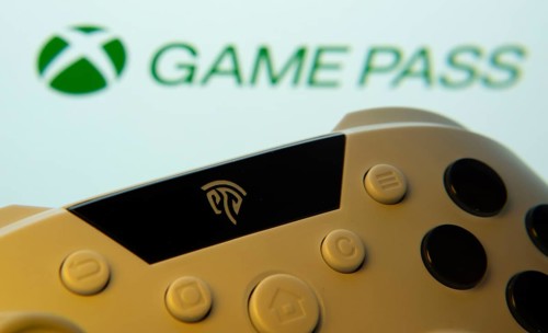 Dhaka, Bangladesh- 01 Nov 2025: A close-up of a gamepad with the Xbox Game Pass seen on screen in
