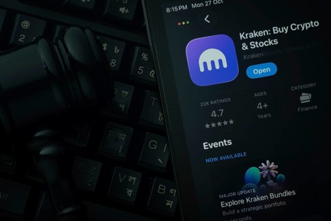 Dhaka, Bangladesh- 28 Oct 2025: An iPad displaying the Kraken app against a judge's gavel and dark