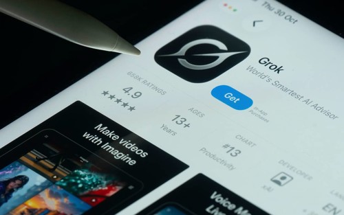 Dhaka, Bangladesh- 30 Oct 2025: Grok Ai app on a iPad screen with a pen pointing at the install