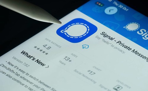 Dhaka, Bangladesh- 30 Oct 2025: Signal app on a iPad screen with a pen pointing at the install