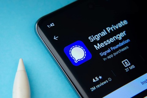 Dhaka, Bangladesh- 29 May 2025: On a blue surface, a smartphone displays the Signal app within the