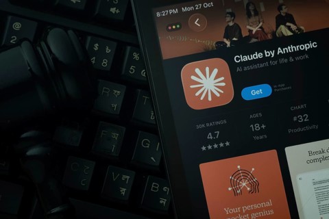 Dhaka, Bangladesh- 28 Oct 2025: An iPad displaying the Claude AI app against a judge's gavel and
