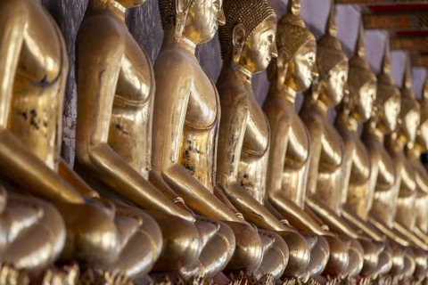 Gilded Buddha statues (Bhumispara mudra: Buddha Gautama at the moment of enlightenment), Wat Suthat