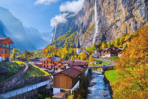 View of town and valley with Staubbach waterfall in autumn, Lauterbrunnen, Bernese Oberland, Canton