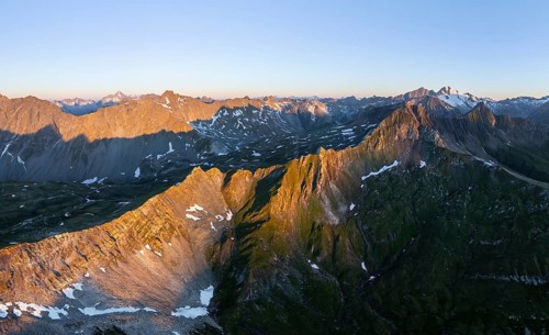 Sunrise 360° Alpine panorama, aerial view of Bachlenkenkopf, summit of the Großvenediger, Venediger