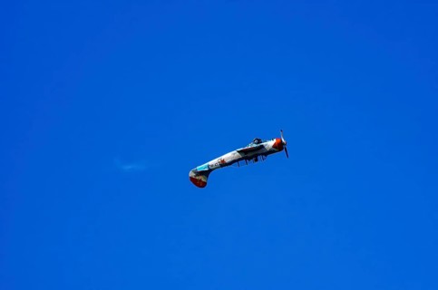 A Jakovlev Jak-52 with registration LY-HLZ during a flight demonstration as part of an air show on