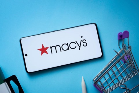 Dhaka, Bangladesh- 03 July 2025: Smartphone displaying Macy's logo with shopping cart on a blue