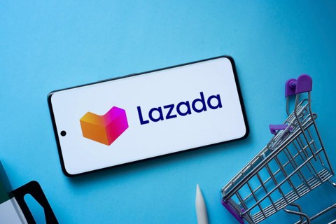 Dhaka, Bangladesh- 03 July 2025: Smartphone displaying Lazada logo with shopping cart on a blue