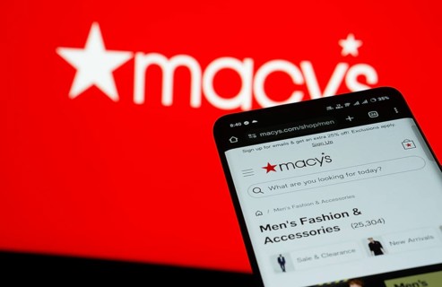 Dhaka, Bangladesh- 03 July 2025: Smartphone displaying Macy's web interface against Macy's logo