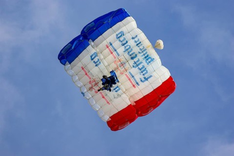 Two parachutists during an aerial acrobatic performance as part of an air show at the Rossfeld in