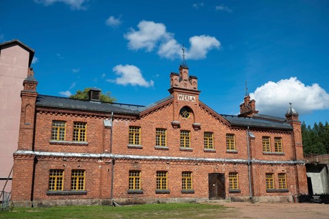 Brick façade with inscription Werla, former paper factory and mill for the production of groundwood