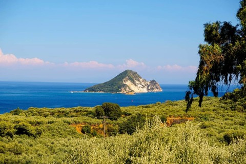 Marathonisi, affectionately known as Turtle Island, is a small, uninhabited islet in the Bay of