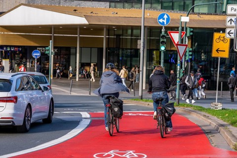 Cycle path, cycle lane, marked in red to draw the attention of motorists to the cycle path, between