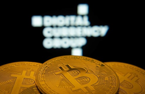 Dhaka, Bangladesh- 03 Oct 2025: Close-up of Bitcoin coins with the Digital currency group logo
