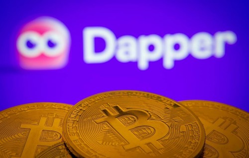 Dhaka, Bangladesh- 03 Oct 2025: Close-up of Bitcoin coins with the Dapper logo visible on a screen
