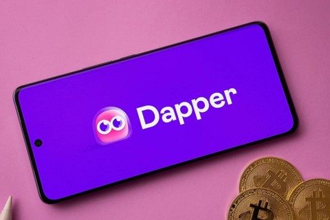 Dhaka, Bangladesh- 03 Oct 2025: Dapper logo on smartphone screen near Bitcoin coin and QR code on