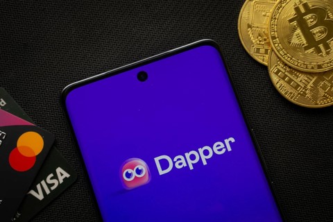 Dhaka, Bangladesh- 03 Oct 2025: Smartphone displaying Dapper logo surrounded by Bitcoin coins and