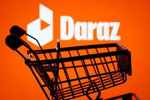 Dhaka, Bangladesh- 03 Oct 2025: Silhouette of a shopping cart in front of the Daraz logo,