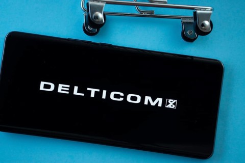 Dhaka, Bangladesh- 03 Oct 2025: Smartphone screen showing the Delticom logo with shopping cart