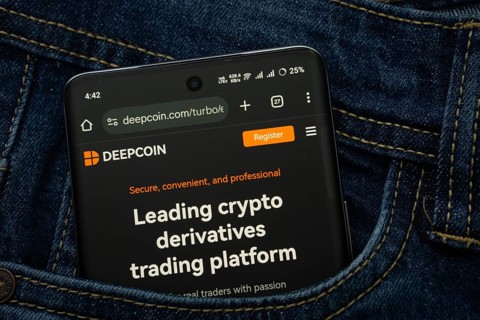 Dhaka, Bangladesh- 03 Oct 2025: A smartphone displaying the Deepcoin web interface peeks out of a