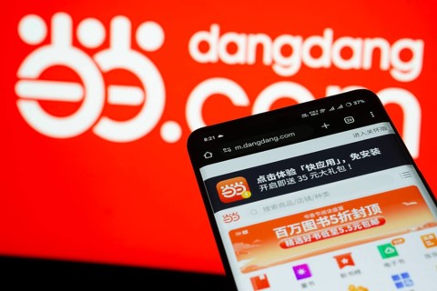 Dhaka, Bangladesh- 03 Oct 2025: Smartphone displaying Dangdang.com web interface against Dangdang