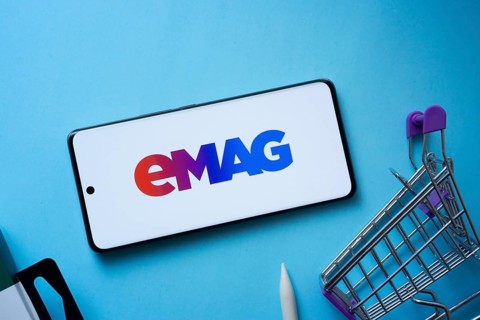 Dhaka, Bangladesh- 03 Oct 2025: Smartphone displaying Emag logo with shopping cart on a blue