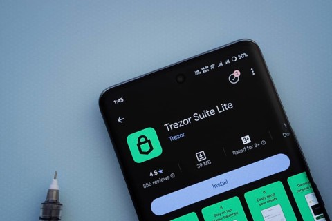 Dhaka, Bangladesh- 30 Sep 2025: On a blue surface, a smartphone displays the Trezor app with in the