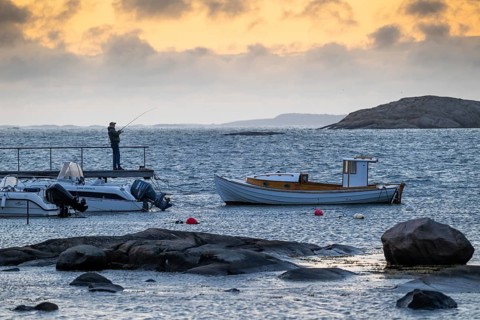 Small bay, archipelago, jetty with angler, Resö Island, Bohuslän, Skagerrak, Sotenäs, Västra