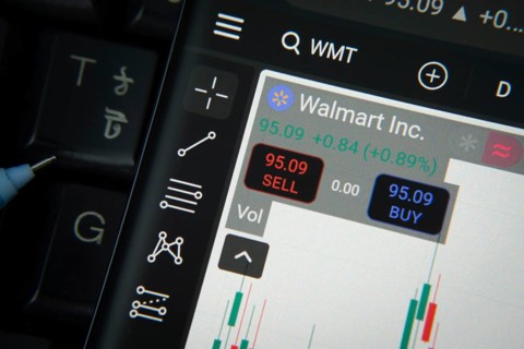 Dhaka, Bangladesh- 20 June 2025: Walmart Inc stock trading details on smartphone over a keyboard
