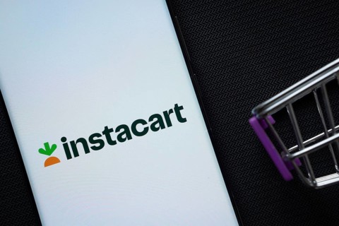 Dhaka, Bangladesh- 03 July 2025: A smartphone displaying the Instacart logo next to a miniature