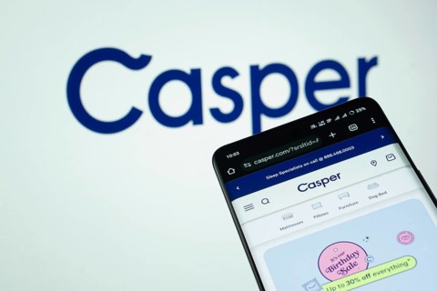Dhaka, Bangladesh- 03 July 2025: Smartphone displaying Casper web interface against Casper logo