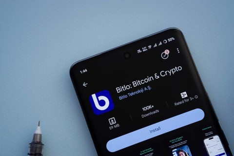 Dhaka, Bangladesh- 29 May 2025: On a blue surface, a smartphone displays the Bitlo app within the