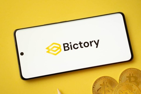 Dhaka, Bangladesh- 09 Sep 2025: Bictory logo on smartphone screen near Bitcoin coin and QR code on
