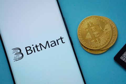 Dhaka, Bangladesh- 03 Sep 2025: Bitmart logo on smartphone screen near Bitcoin coin and QR code on