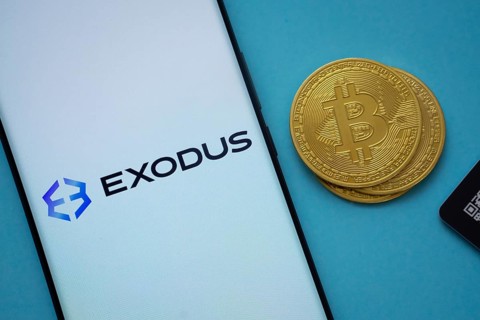 Dhaka, Bangladesh- 06 Sep 2025: Exodus logo on smartphone screen near Bitcoin coin and QR code on