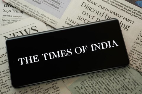 Dhaka, Bangladesh - 18 March 2025: The logo of the times of india is displayed on a smartphone