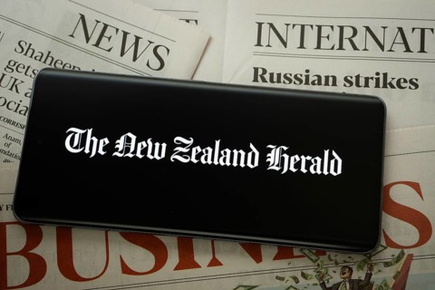 Dhaka, Bangladesh - 18 March 2025: The logo of the new zealand herald is displayed on a smartphone
