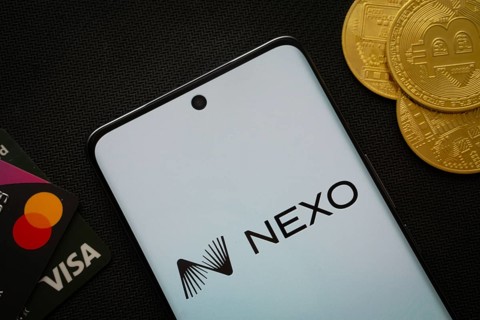 Dhaka, Bangladesh- 06 Sep 2025: Smartphone displaying nexo logo surrounded by Bitcoin coins and