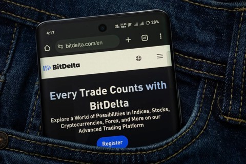 Dhaka, Bangladesh- 15 June 2025: A smartphone displaying the BitDelta.com web interface peeks out