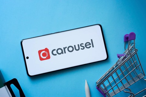 Dhaka, Bangladesh- 03 July 2025: Smartphone displaying Carousell logo with shopping cart on a blue