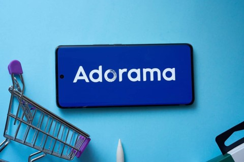 Dhaka, Bangladesh- 03 July 2025: Smartphone displaying Adorama logo with shopping cart on a blue