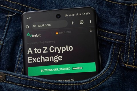 Dhaka, Bangladesh- 15 June 2025: A smartphone displaying the Azbit.com web interface peeks out of a